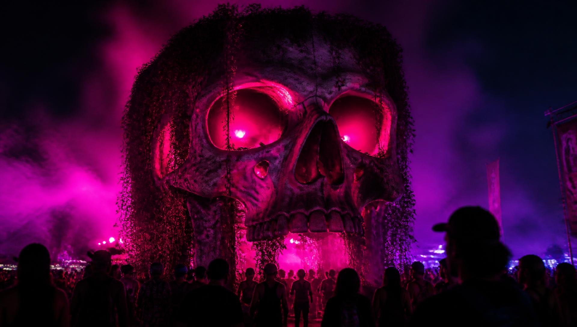 Giant illuminated skull set piece built for a festival attraction